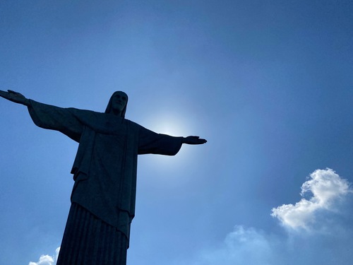 Christ the Redeemer towers into an empty blue sky